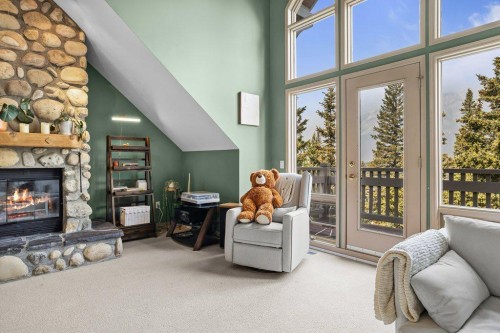 14 Antelope Lane, Banff, AB - Indoor Photo Showing Living Room With Fireplace