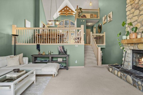 14 Antelope Lane, Banff, AB - Indoor With Fireplace