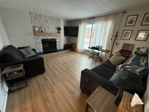 34 Wedow Drive, Whitecourt, AB - Indoor Photo Showing Living Room With Fireplace