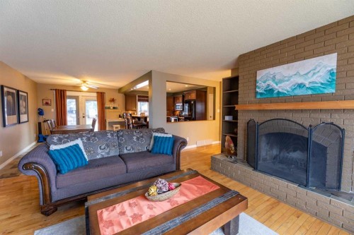 124 Cheviot Drive, Hinton, AB - Indoor Photo Showing Living Room With Fireplace
