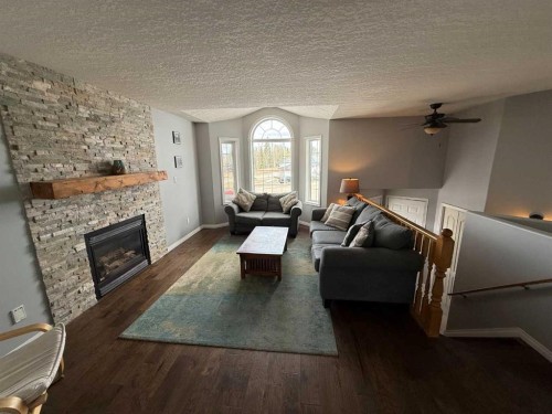 110 Parker Place, Hinton, AB - Indoor Photo Showing Living Room With Fireplace