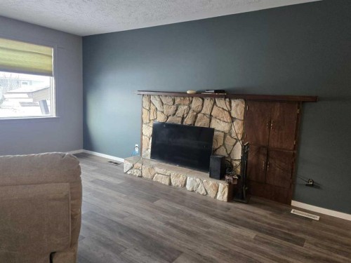 101 Simpson Street, Hinton, AB - Indoor Photo Showing Living Room With Fireplace