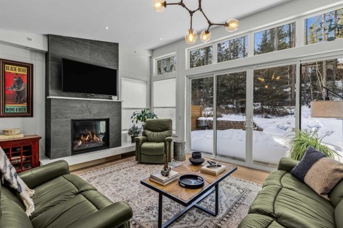 283C Three Sisters Drive, Canmore, AB - Indoor Photo Showing Living Room With Fireplace