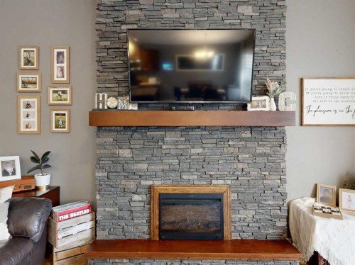 11 Abraham Drive, Whitecourt, AB - Indoor Photo Showing Living Room With Fireplace