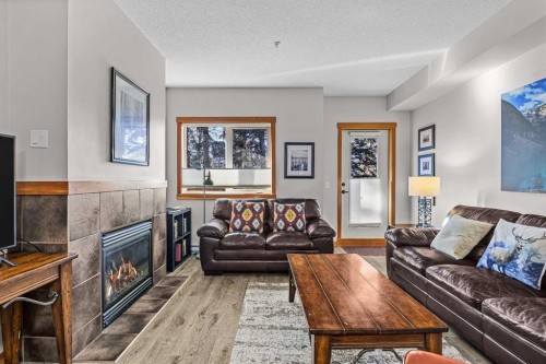 107-101 Montane Road Sw, Canmore, AB - Indoor Photo Showing Living Room With Fireplace