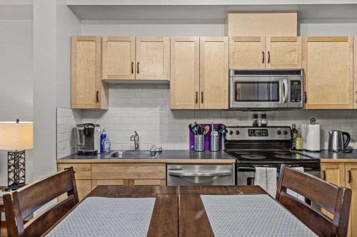 107-101 Montane Road Sw, Canmore, AB - Indoor Photo Showing Kitchen With Double Sink