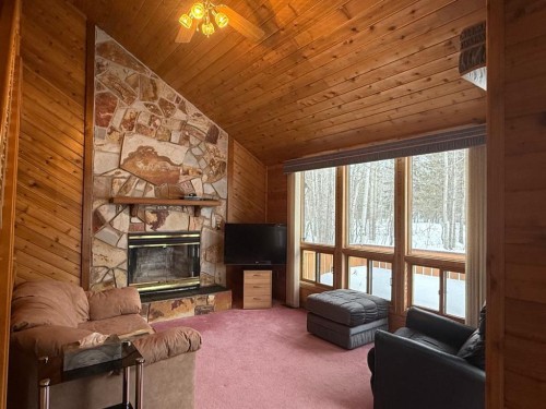 34 Ella Mae Crescent, Whispering Hills, AB - Indoor Photo Showing Living Room With Fireplace