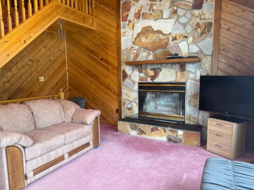 34 Ella Mae Crescent, Whispering Hills, AB - Indoor Photo Showing Living Room With Fireplace