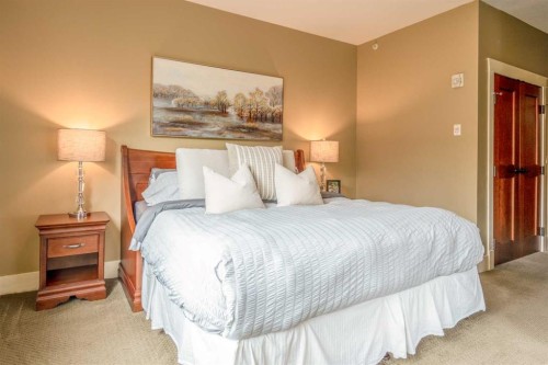 406-187 Kananaskis Way, Canmore, AB - Indoor Photo Showing Bedroom
