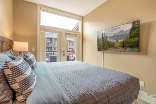 406-187 Kananaskis Way, Canmore, AB - Indoor Photo Showing Bedroom