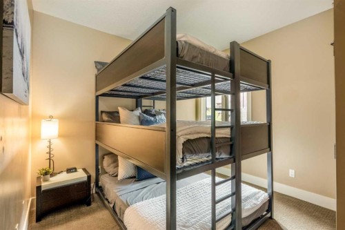 406-187 Kananaskis Way, Canmore, AB - Indoor Photo Showing Bedroom