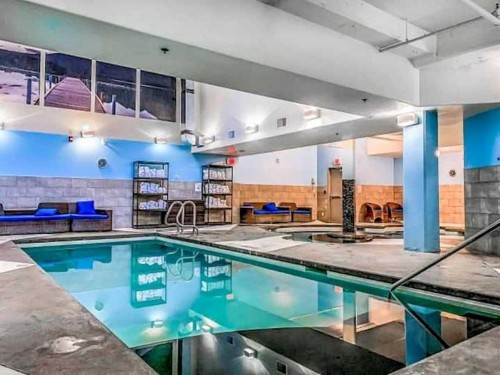 406-187 Kananaskis Way, Canmore, AB - Indoor Photo Showing Other Room With In Ground Pool