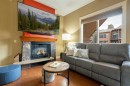 406-187 Kananaskis Way, Canmore, AB  - Indoor Photo Showing Living Room With Fireplace 