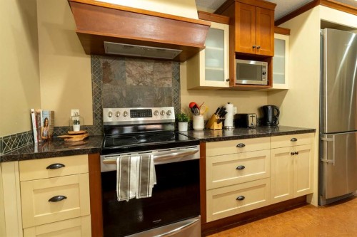406-187 Kananaskis Way, Canmore, AB - Indoor Photo Showing Kitchen With Stainless Steel Kitchen