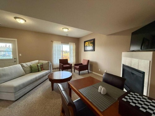 294 Tocher Avenue, Hinton, AB - Indoor Photo Showing Living Room With Fireplace