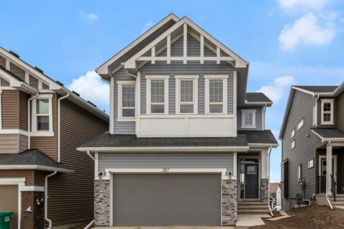 287 Rivercrest Boulevard, Cochrane, AB - Outdoor With Facade