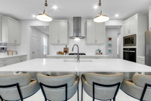 287 Rivercrest Boulevard, Cochrane, AB - Indoor Photo Showing Kitchen With Upgraded Kitchen