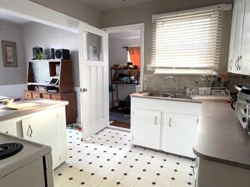 4905 42 Street, Athabasca, AB - Indoor Photo Showing Kitchen With Double Sink