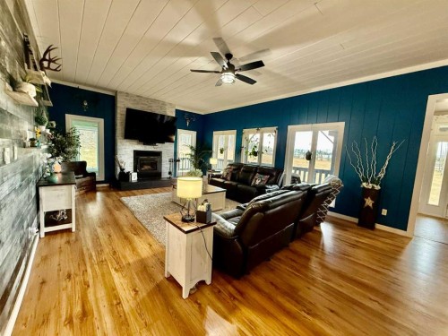 24403 East River Road, Hinton, AB - Indoor Photo Showing Living Room With Fireplace