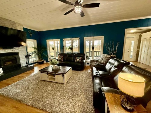 24403 East River Road, Hinton, AB - Indoor Photo Showing Living Room With Fireplace
