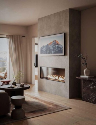 103-1717 Bow Valley Trail, Canmore, AB - Indoor Photo Showing Living Room With Fireplace