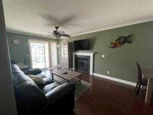 302-3 501 Street, Fox Creek, AB - Indoor Photo Showing Living Room With Fireplace