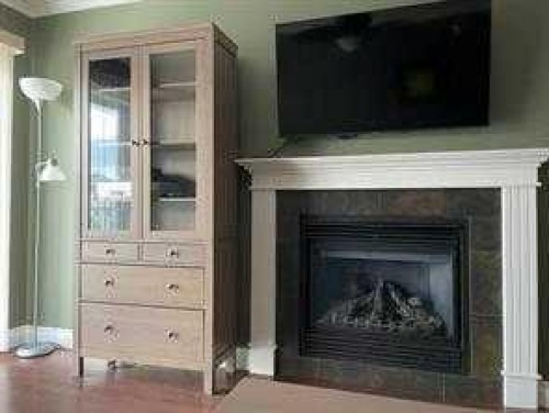 302-3 501 Street, Fox Creek, AB - Indoor Photo Showing Living Room With Fireplace