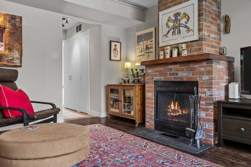 4-630 3Rd Street, Canmore, AB - Indoor Photo Showing Living Room With Fireplace