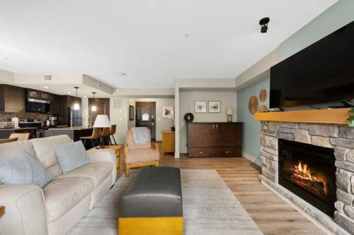 2206-250 2 Avenue, Dead Man'S Flats, AB - Indoor Photo Showing Living Room With Fireplace