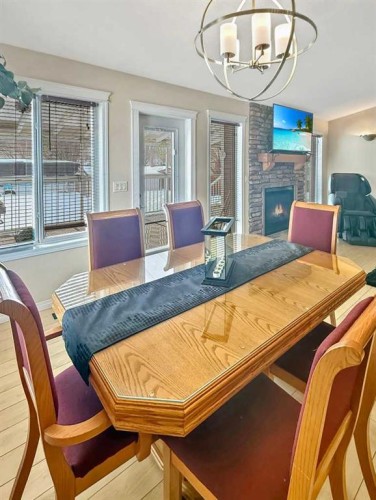3 Powers Cove, Whitecourt, AB - Indoor Photo Showing Dining Room With Fireplace