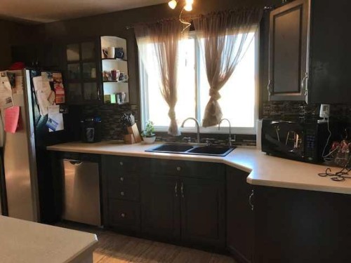 712 3 Avenue, Fox Creek, AB - Indoor Photo Showing Kitchen With Double Sink