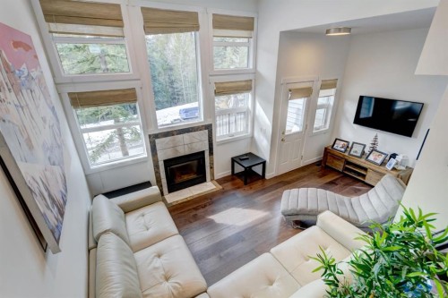 18-242 Benchlands Terrace, Canmore, AB - Indoor Photo Showing Living Room With Fireplace