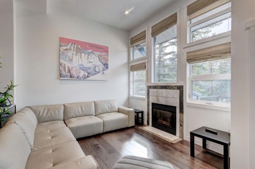 18-242 Benchlands Terrace, Canmore, AB - Indoor Photo Showing Living Room With Fireplace