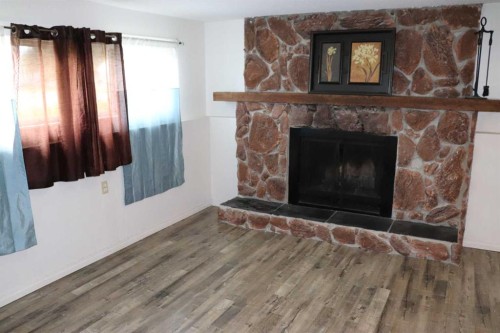 5518 13 Avenue, Edson, AB - Indoor Photo Showing Living Room With Fireplace
