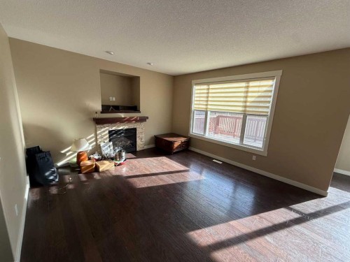 105 Wolf Willow Cove, Hinton, AB - Indoor Photo Showing Living Room With Fireplace