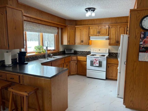 #28 Aspen Cres, Rural Athabasca County, AB - Indoor Photo Showing Kitchen With Double Sink