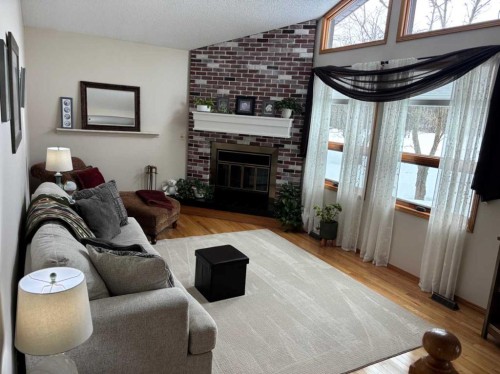 #28 Aspen Cres, Rural Athabasca County, AB - Indoor Photo Showing Living Room With Fireplace