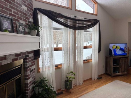 #28 Aspen Cres, Rural Athabasca County, AB - Indoor Photo Showing Other Room With Fireplace