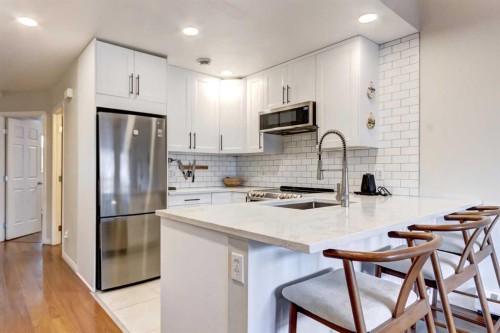 210-112 Kananaskis Way, Canmore, AB - Indoor Photo Showing Kitchen With Stainless Steel Kitchen With Upgraded Kitchen