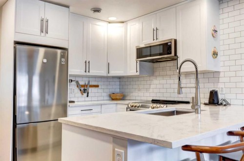 210-112 Kananaskis Way, Canmore, AB - Indoor Photo Showing Kitchen With Stainless Steel Kitchen With Upgraded Kitchen