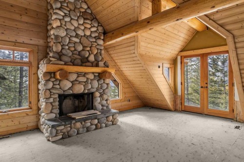 11 Aspen Glen, Canmore, AB - Indoor Photo Showing Living Room With Fireplace