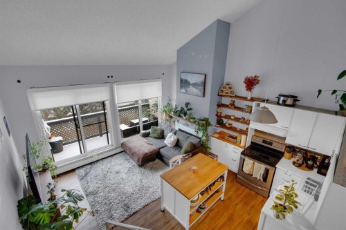 310-414 Squirrel Street, Banff, AB - Indoor Photo Showing Living Room