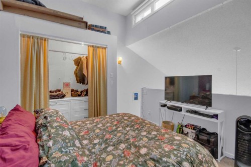 310-414 Squirrel Street, Banff, AB - Indoor Photo Showing Bedroom