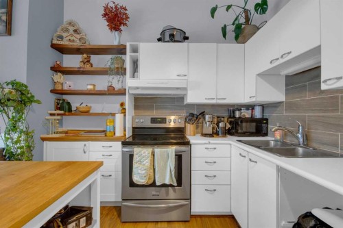 310-414 Squirrel Street, Banff, AB - Indoor Photo Showing Kitchen With Double Sink
