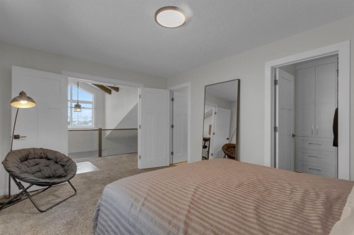 2-729 7Th, Canmore, AB - Indoor Photo Showing Bedroom