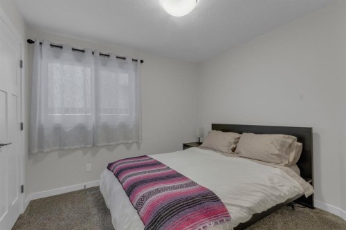2-729 7Th, Canmore, AB - Indoor Photo Showing Bedroom