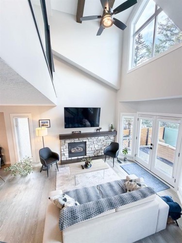2-729 7Th, Canmore, AB - Indoor Photo Showing Living Room With Fireplace
