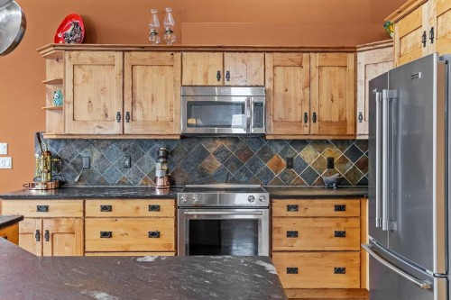 B-243 Three Sisters Drive, Canmore, AB - Indoor Photo Showing Kitchen With Stainless Steel Kitchen