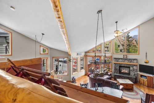 B-243 Three Sisters Drive, Canmore, AB - Indoor With Fireplace