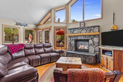 B-243 Three Sisters Drive, Canmore, AB - Indoor Photo Showing Living Room With Fireplace